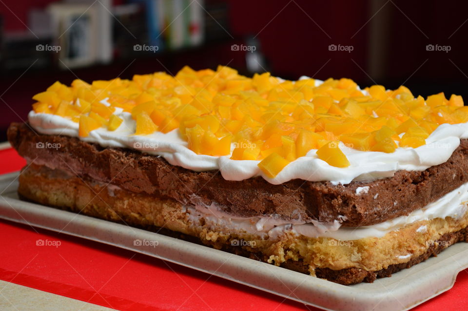 Close-up of peaches garnished on cake