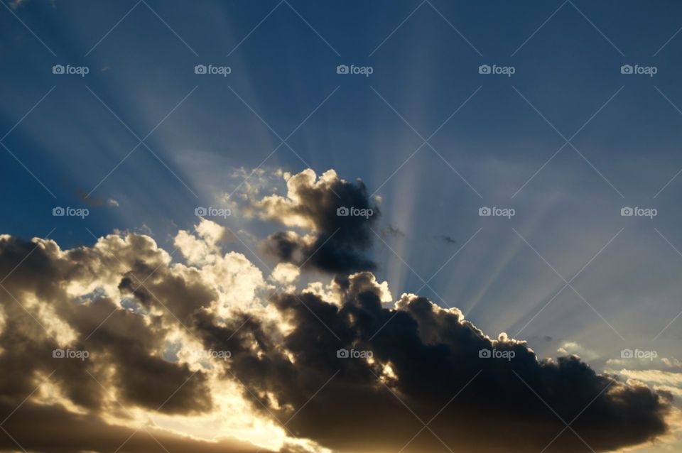 Suns rays through a cloud 