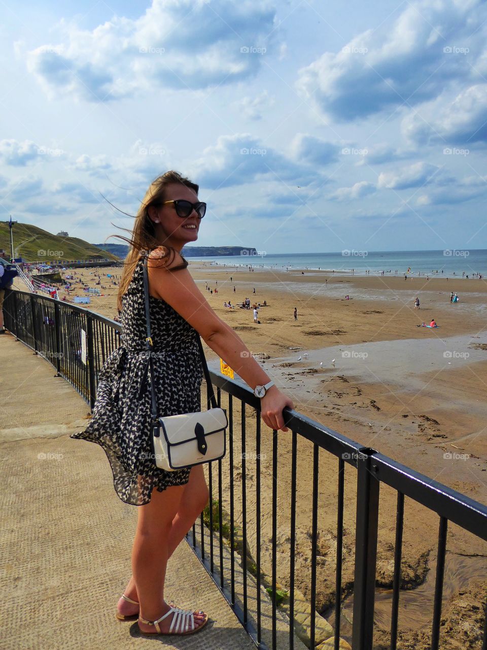 Smiling woman standing on beach