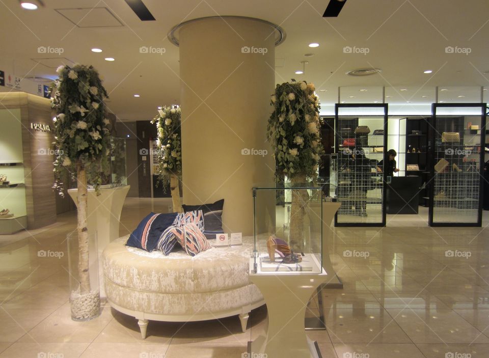 Elegant Floral Display and White Sofa with Pillows, inside Ginza Shopping Mall, Tokyo Japan