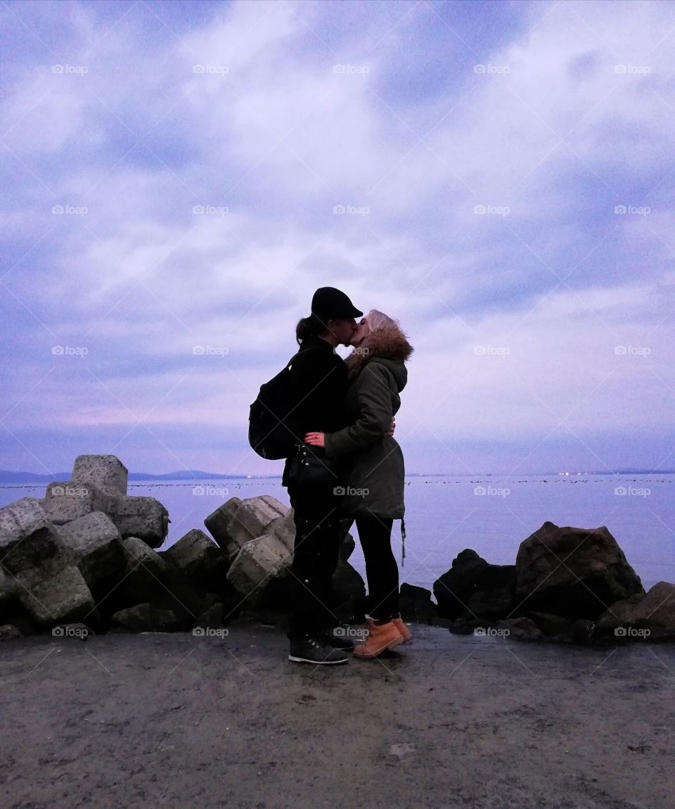 Love by seaside in Bulgaria, Pomorie with the backround of beautiful sky