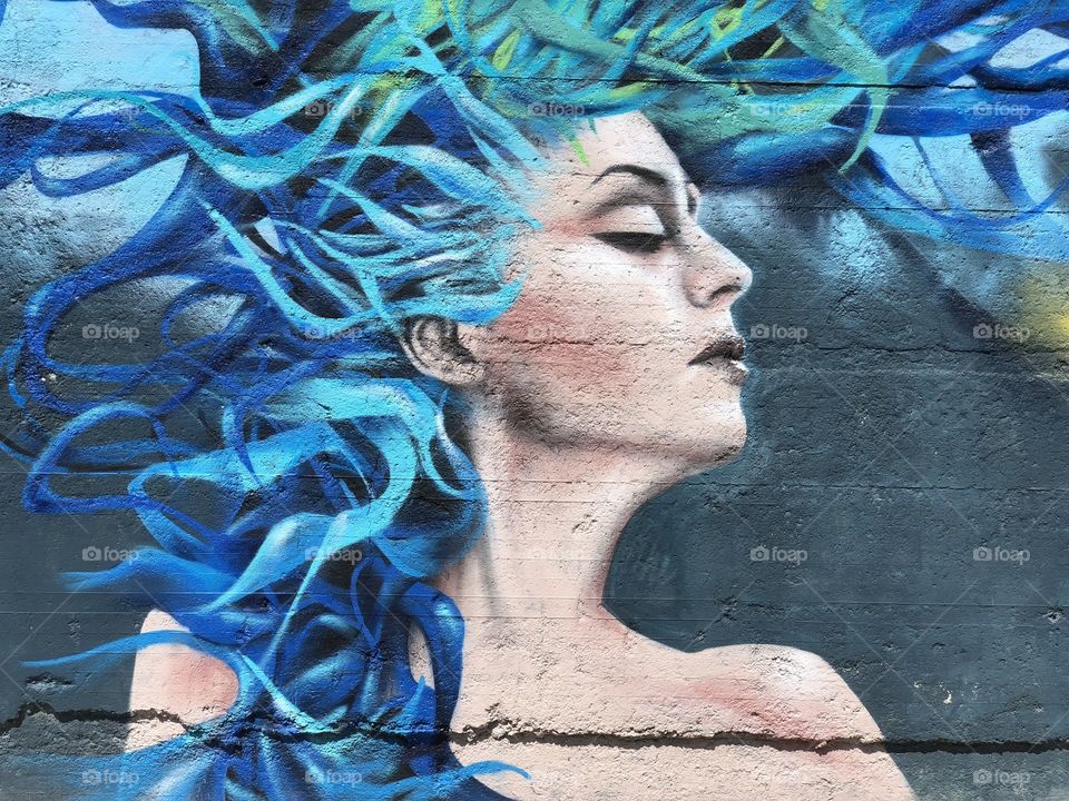 Graffiti with a blue haired girl