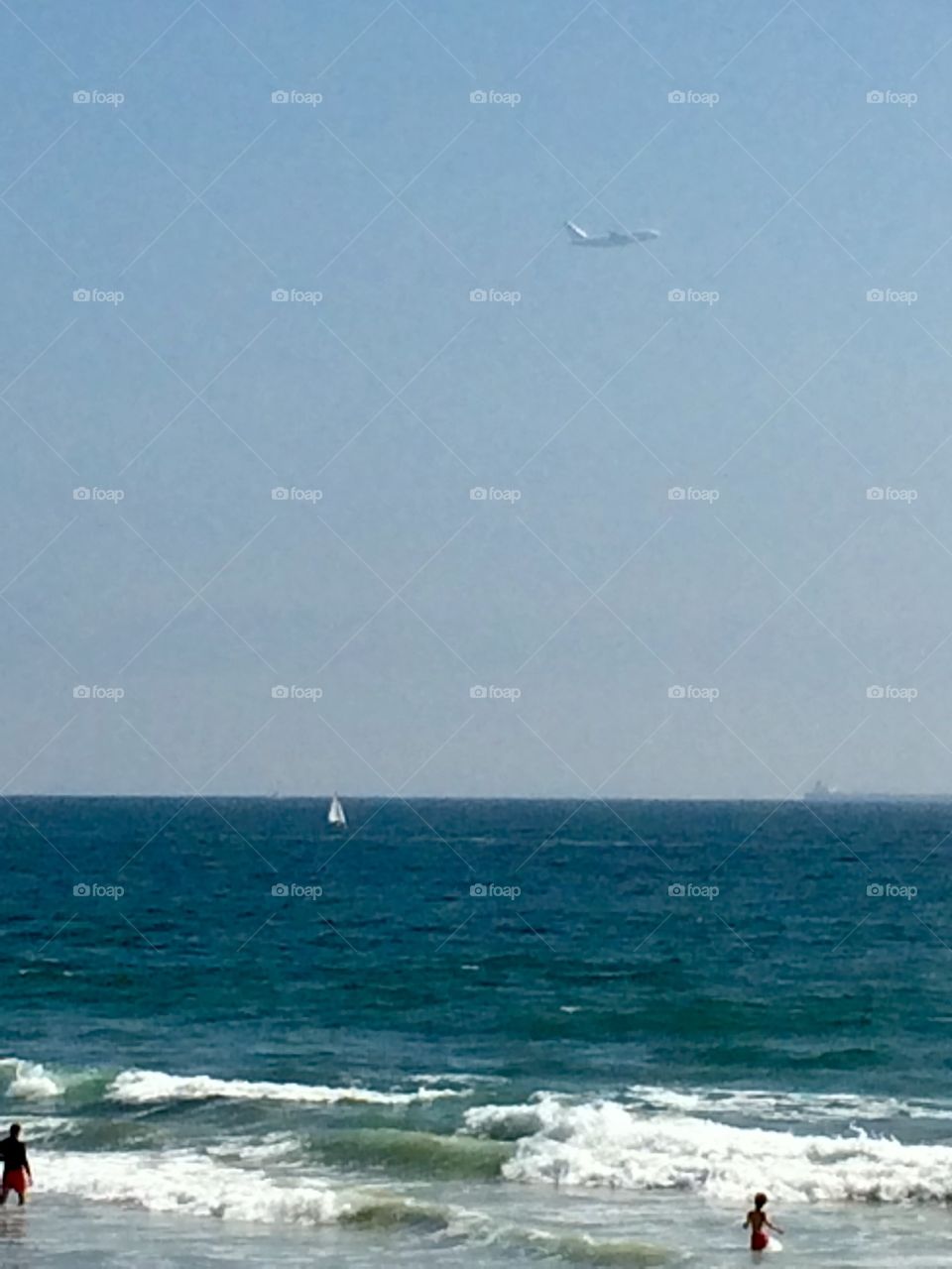 “Oversea-ers” is a shot showing multiple objects in, on and over water. 