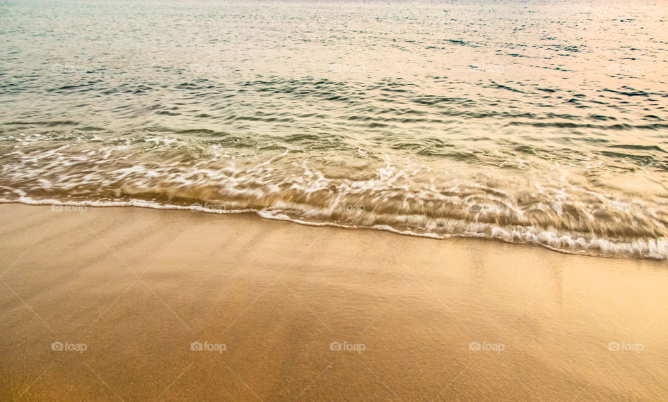 Sea Wave On The Sand Beach
