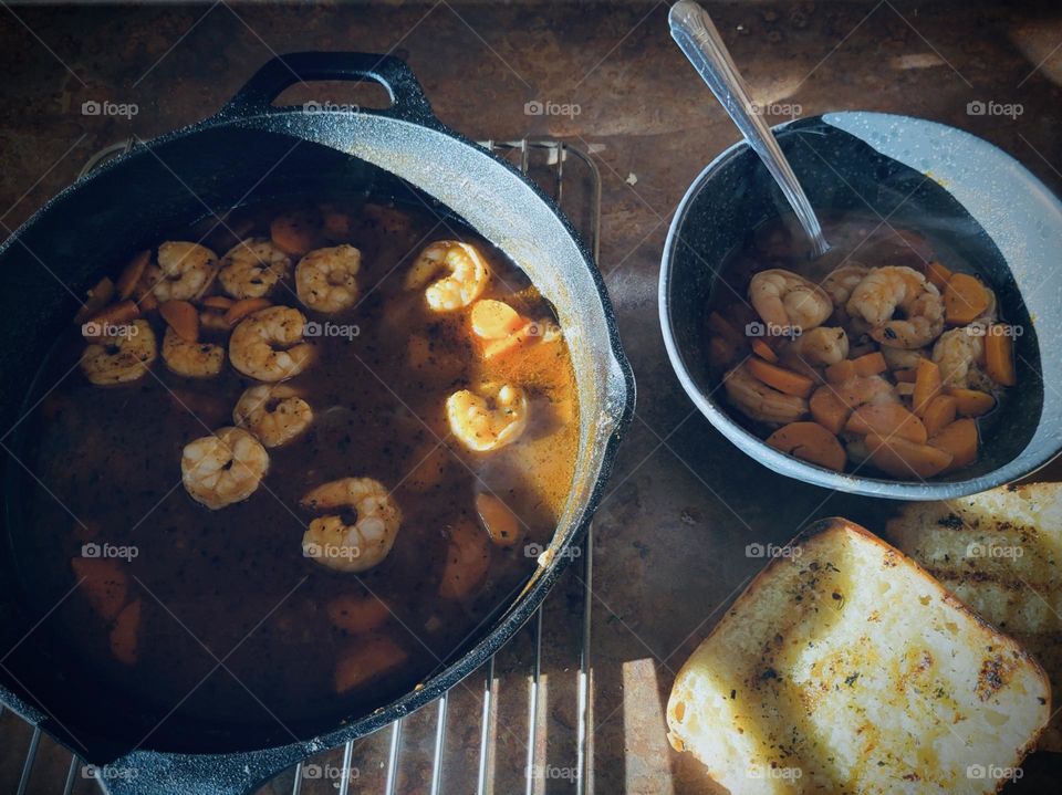 Soup with vegetable broth and juicy prawns...
