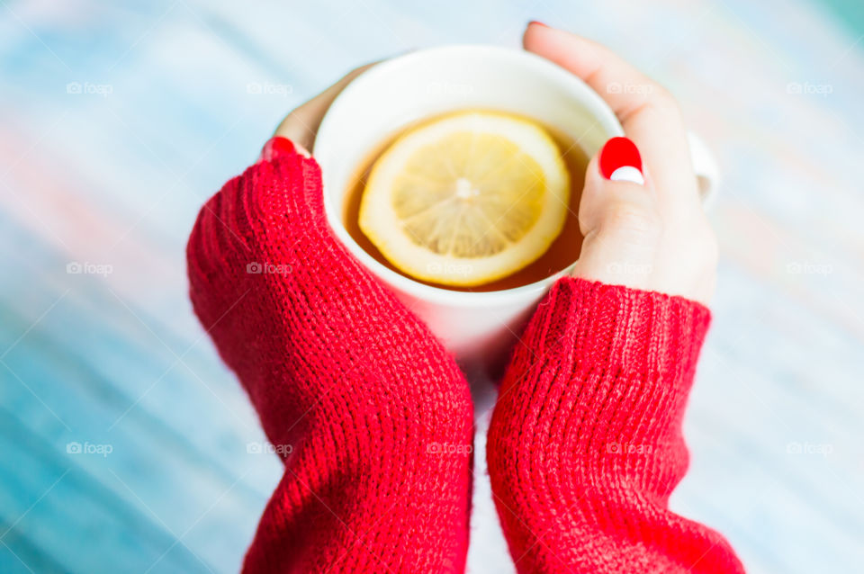 woman hand with cup of tea