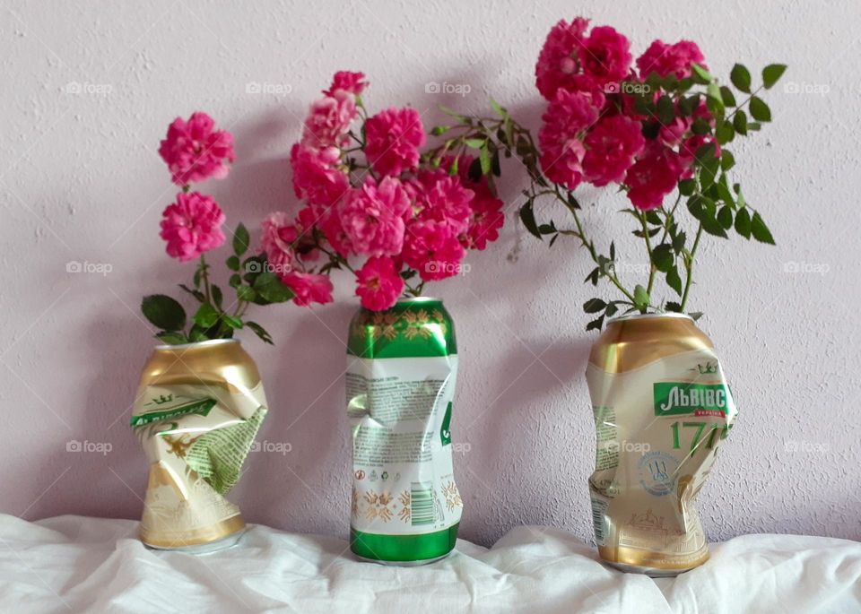 Flowers in metal beer cans