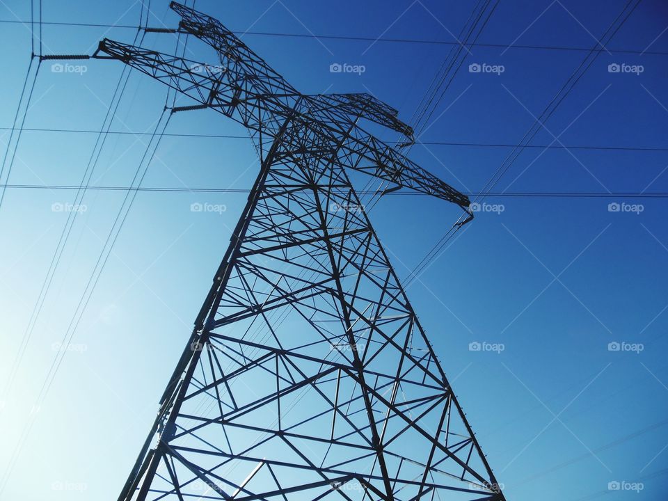 high line wire. This is a picture of a power line pole that I was standing under