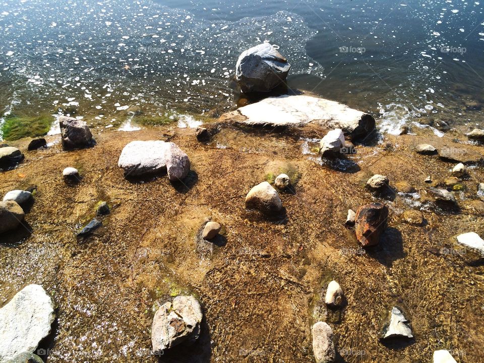 Rocks and glimmering water 