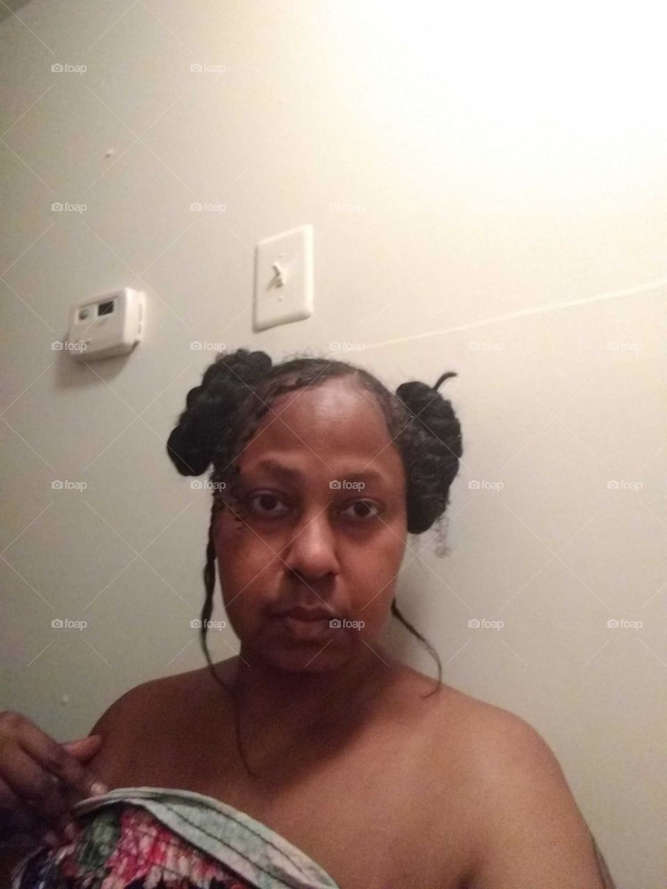 Me after putting my hair up in two buns. Taking a fresh shot for the camera 🤳🏾 📸.