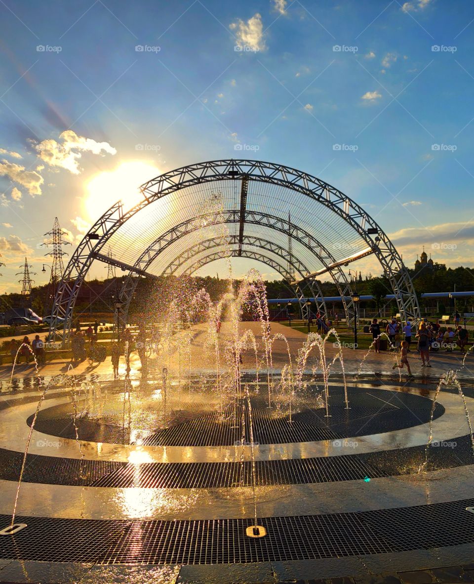 City fountain at sunset
