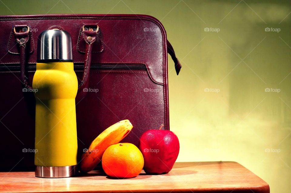 Briefcase, fruits, and flask