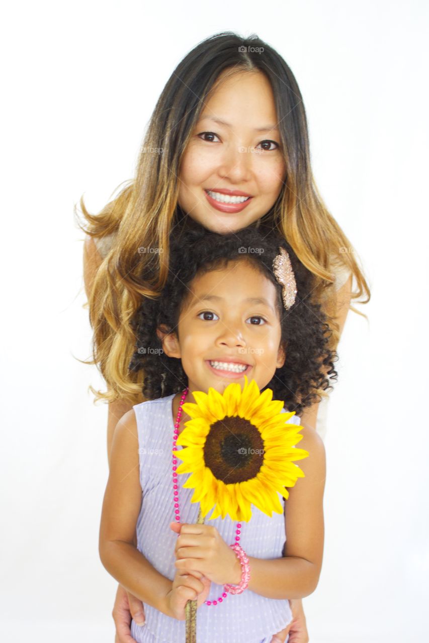 Family takes a spontaneous shot after an event and it looks like a professional studio session, sunflower and all!  24mb version available upon request along with other shots of these two at the same event :)