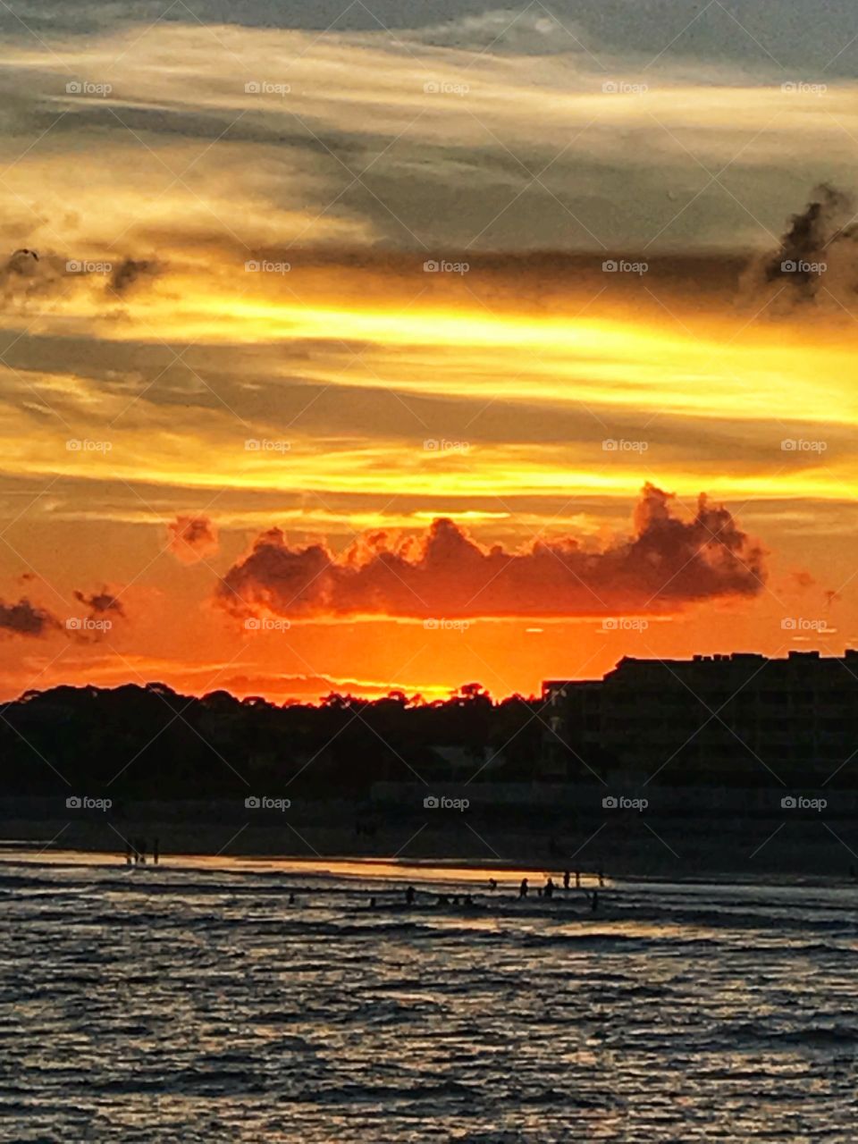 Watching the sun going down from the beach pier 