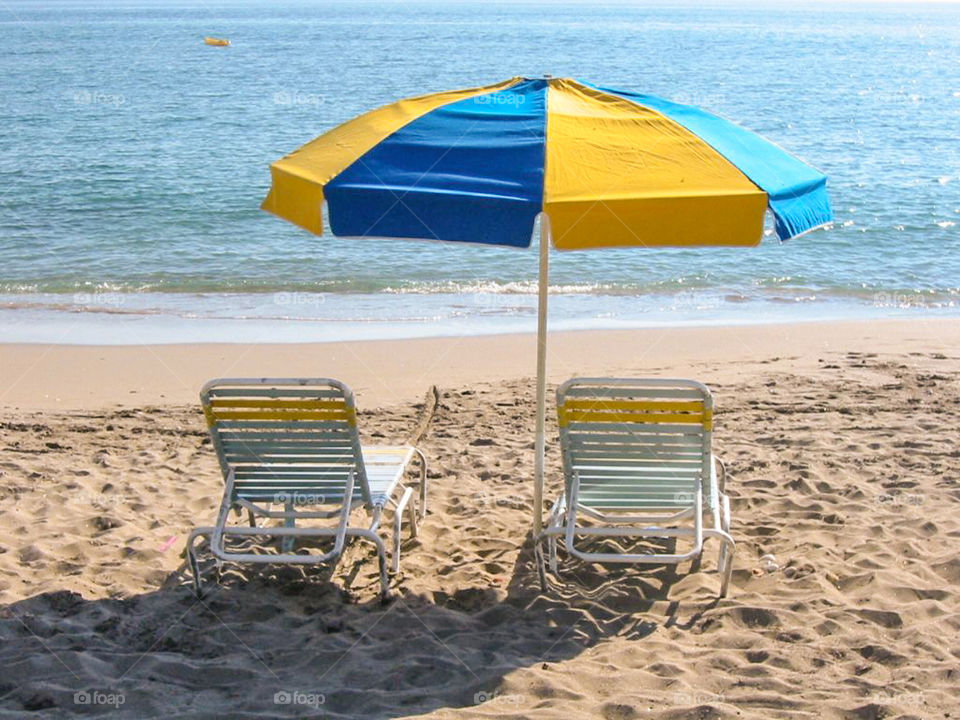 Beach chairs and parasol