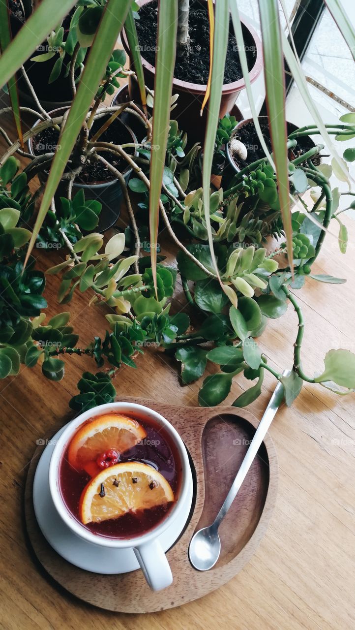 Cup of tea with fruits