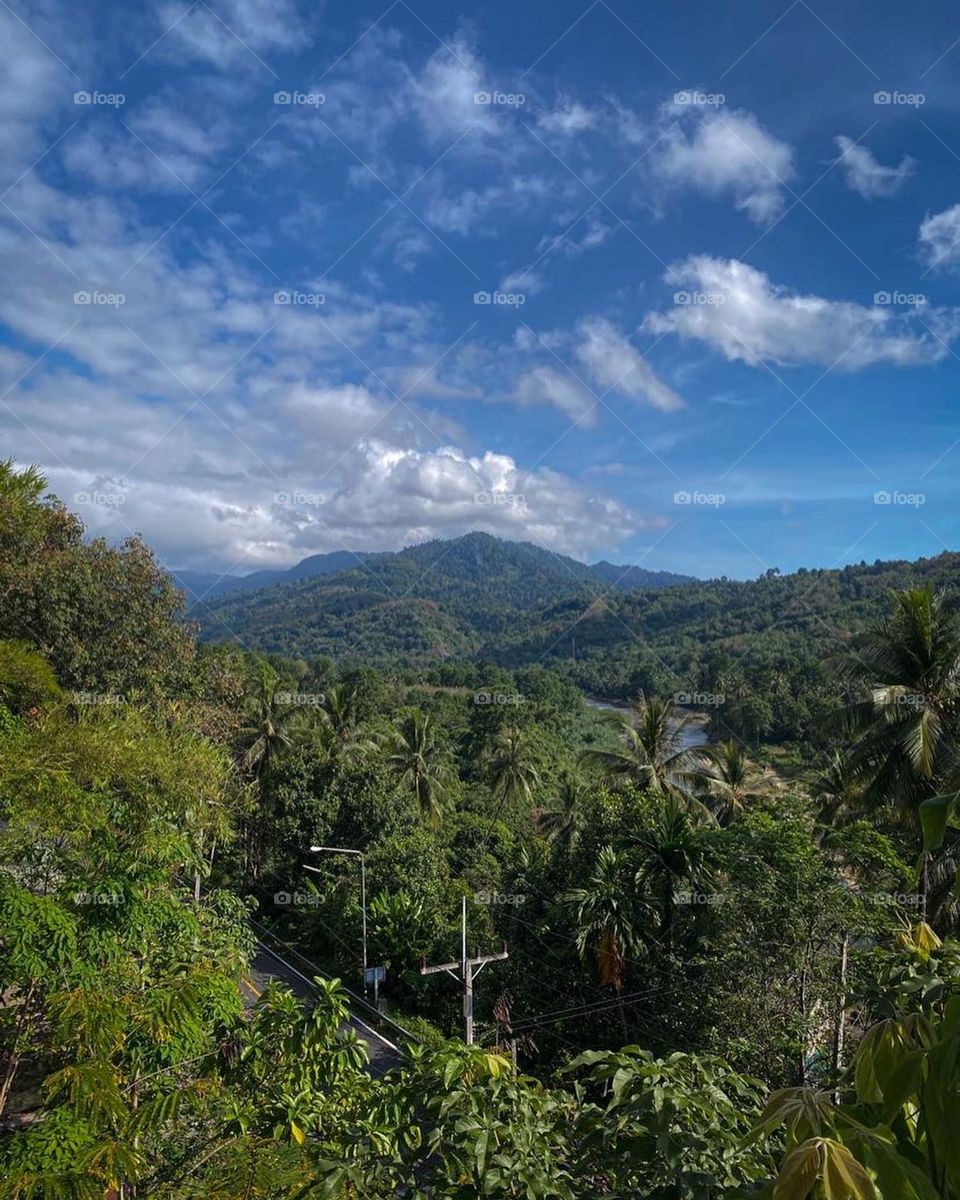Beautiful mountainous jungle view with storm behind 