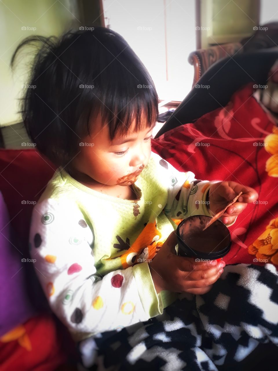 child photography, child enjoying her favourite chocolate ice cream