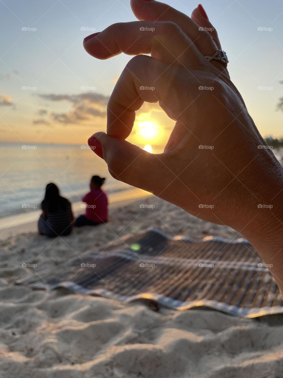 Sunset between fingers
