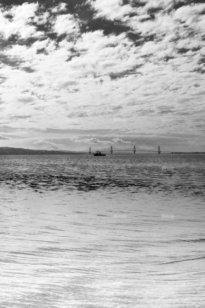 view Rio-Antirrio bridge in black and white in Gulf of Corinth