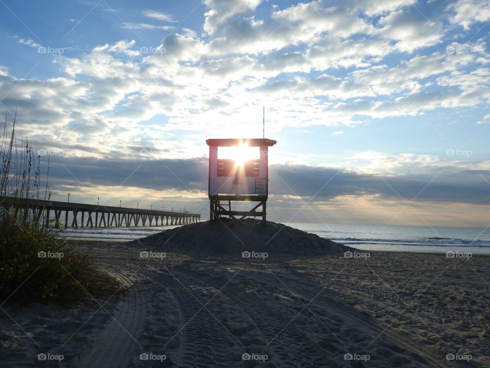 Sunlight shining through the lifeguard stand. Johnnie Mercer's Pier.