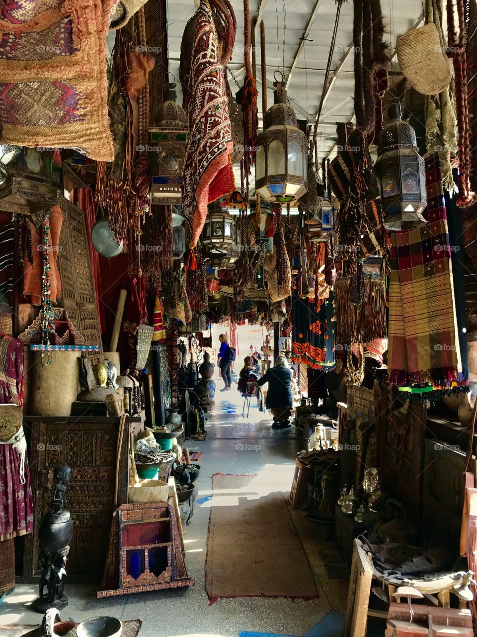 Beautiful furnished shop in Marrakech full of textiles leathers and objects jn marrocan style