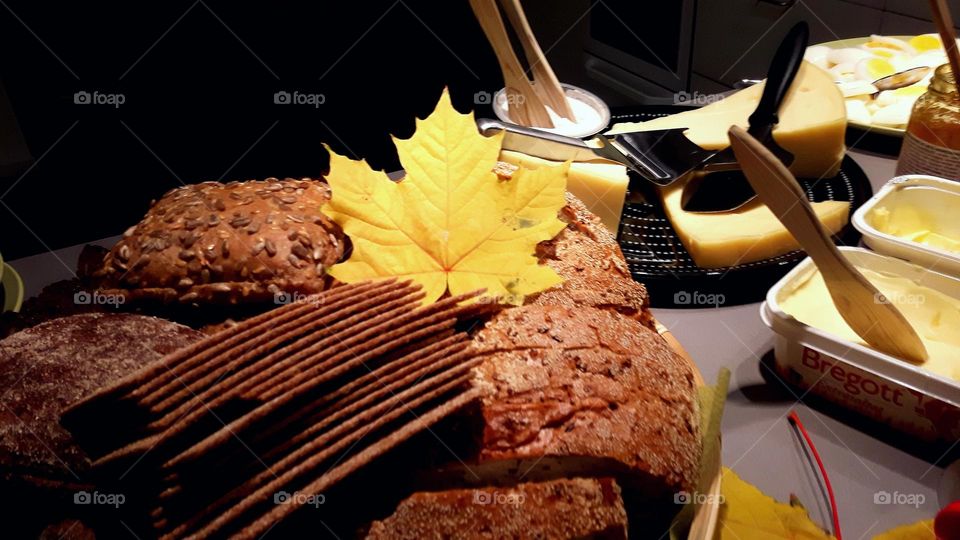 Yellow leaf on the breakfast table