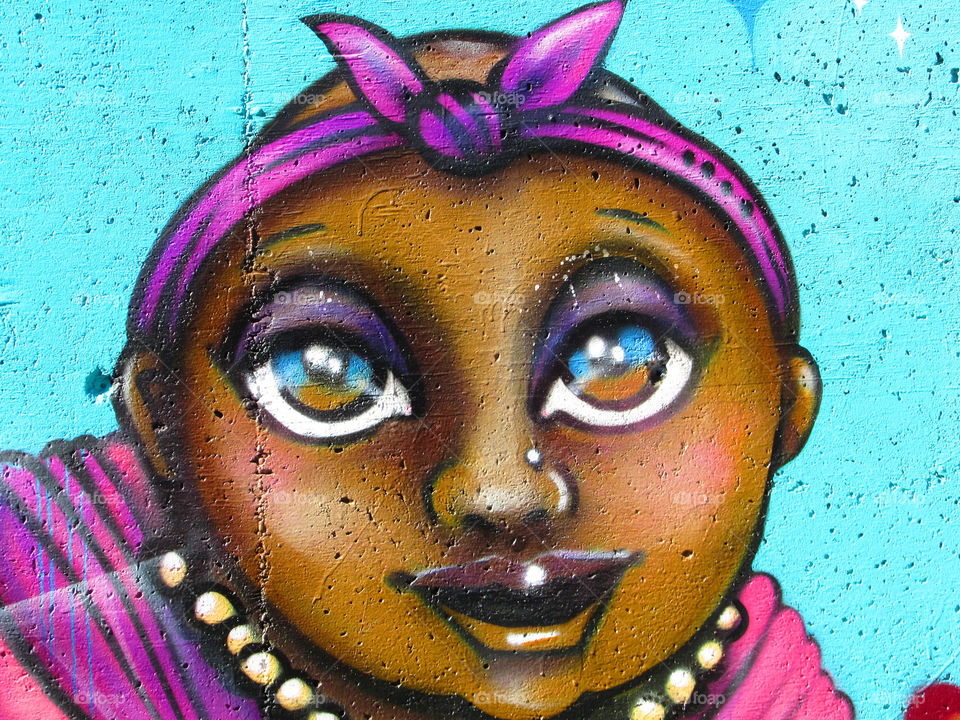 wide-eyed painting of a little girl