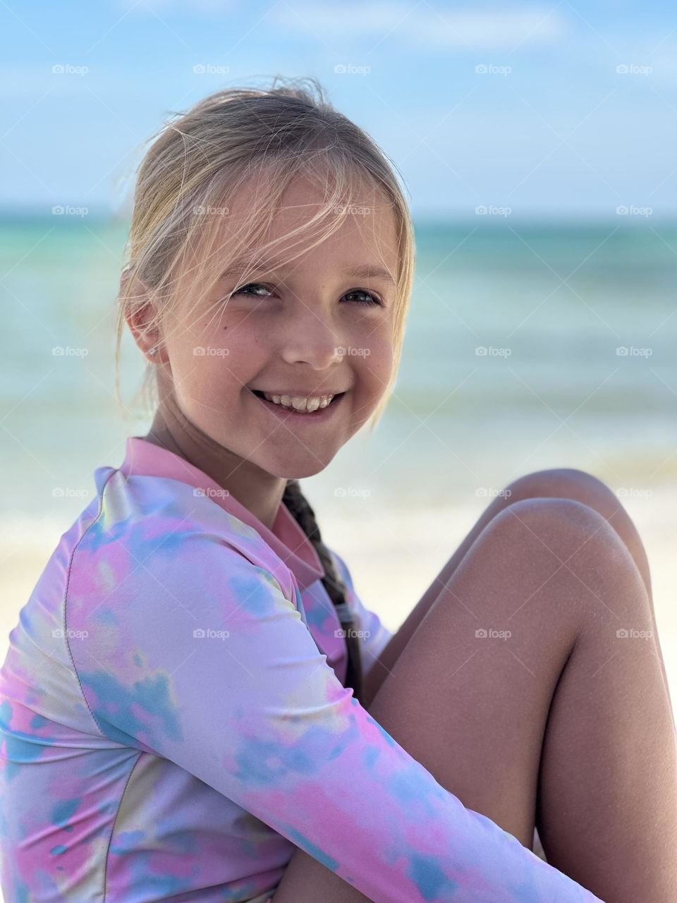 Candid portrait of beautiful little girl with smiley face