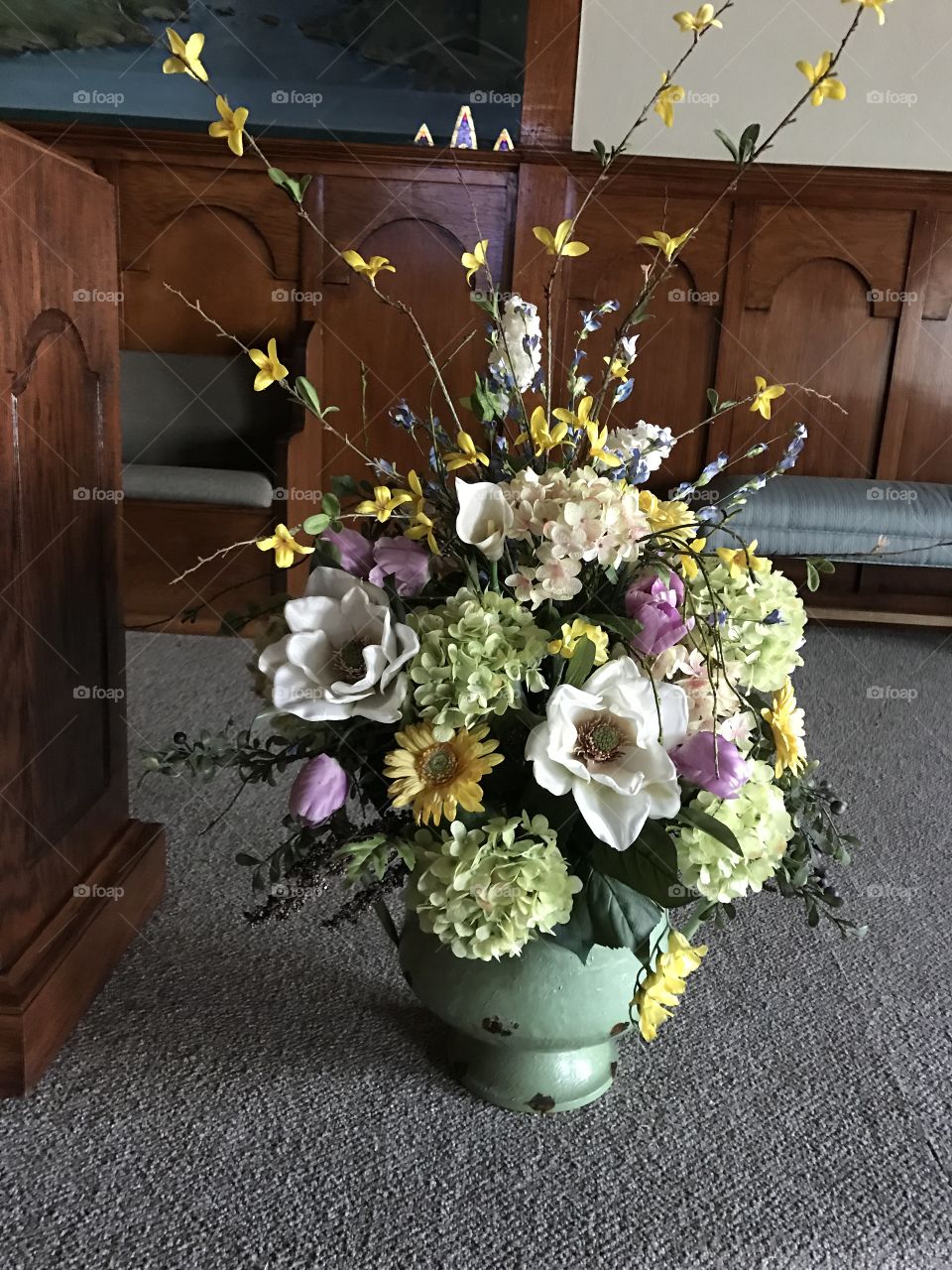 A beautiful Spring floral arrangement for a church podium.
