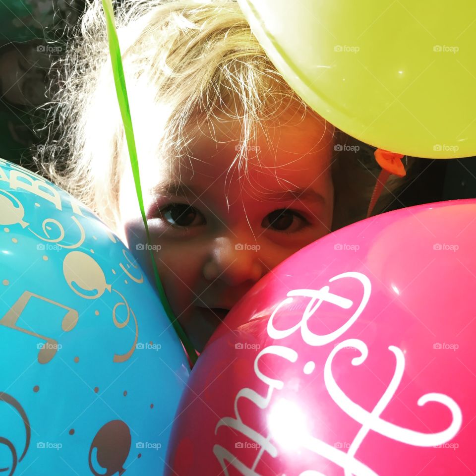 Baby in the balloons.