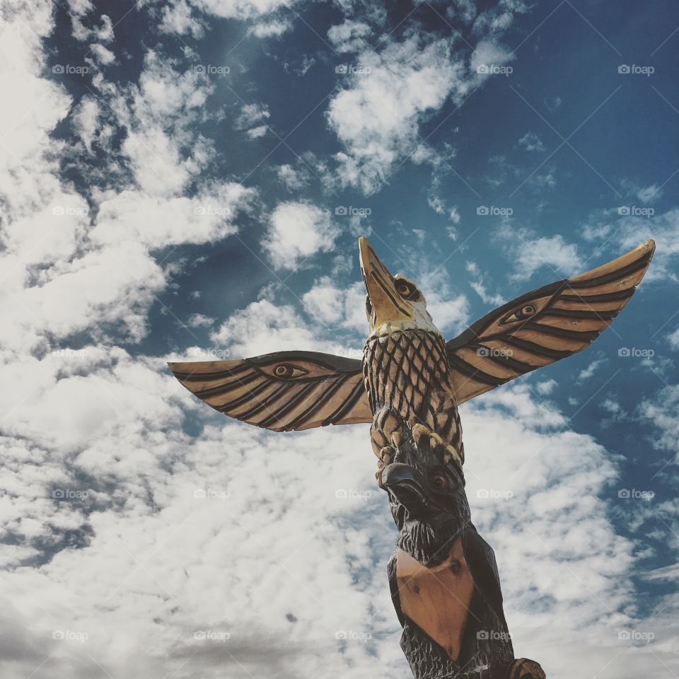 Alaskan Totem Pole in Soldotna , wooden carving , eagle 