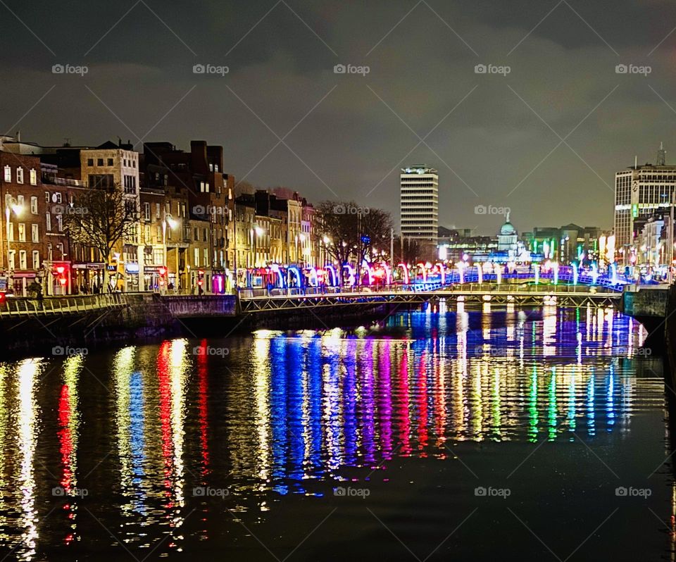 The Millennium Footbridge reflecting off the River Liffey in Dublin, Ireland.