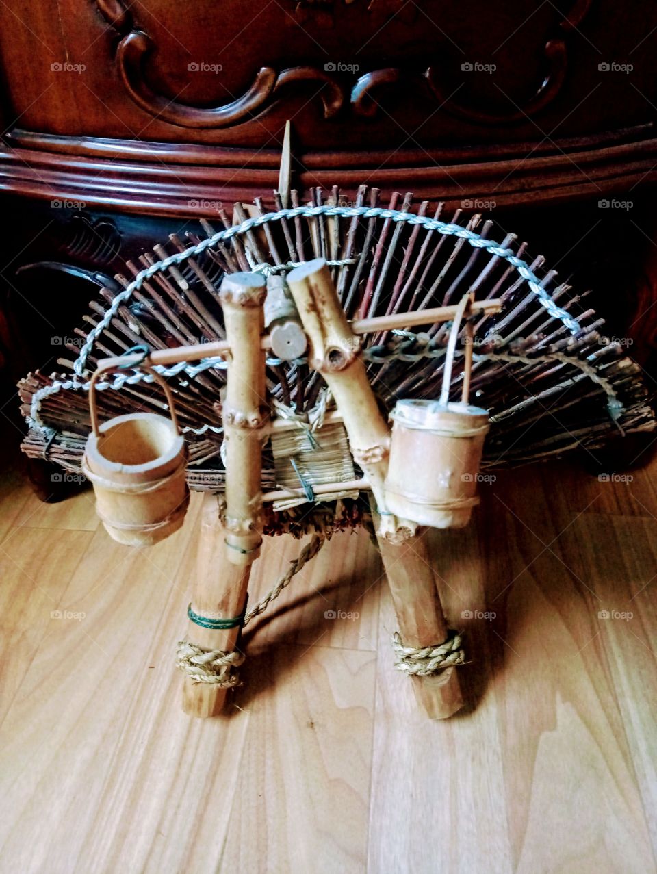 the mini water jar along with the basket that's used for gathering woods.