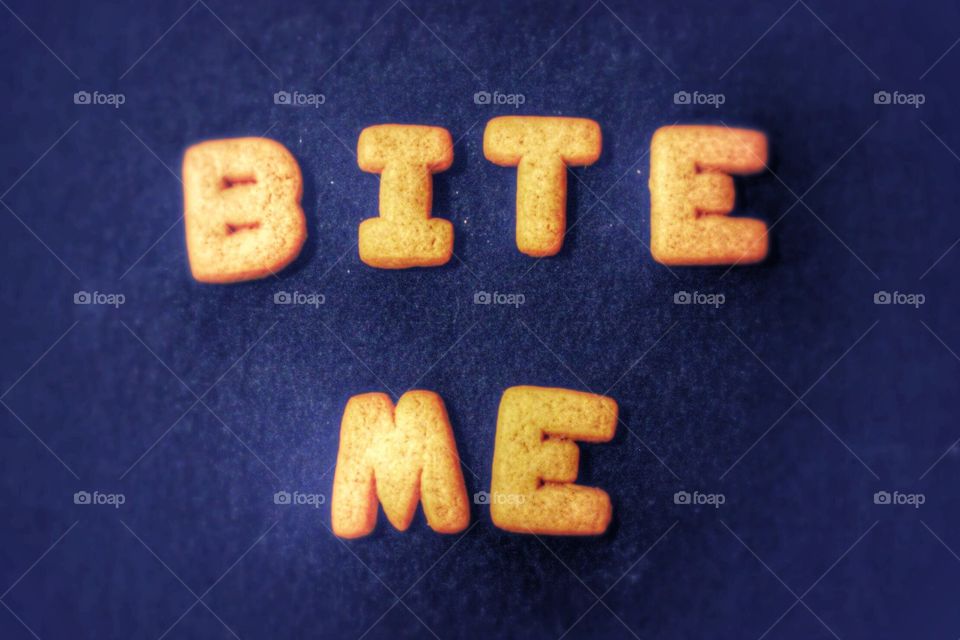 alphabet cookies made into words with dark blue background