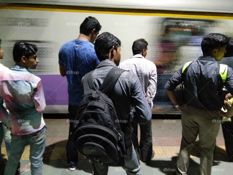 people straggled to get on train after work..and some waiting for to get home