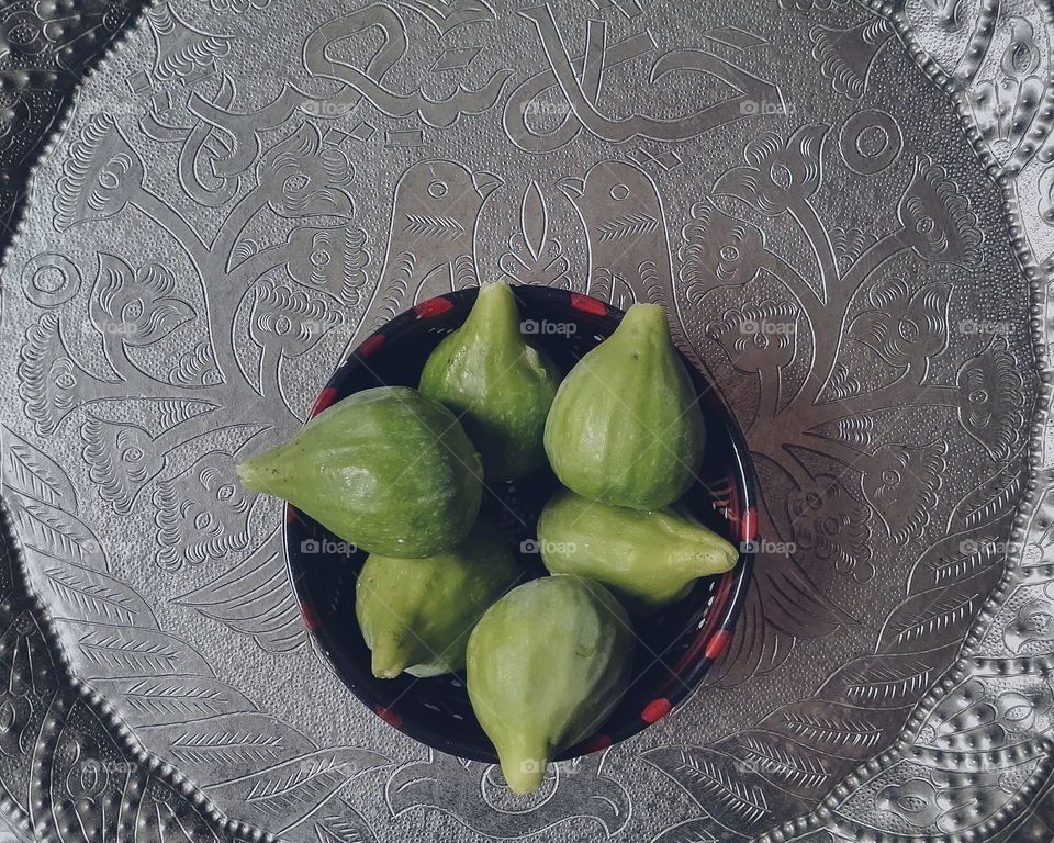 Figs in a bowl, on a traditional Moroccan metallic tray