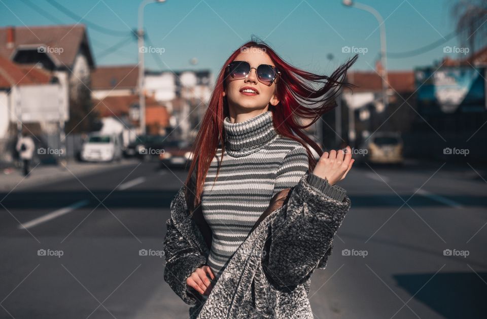 Women Waving Red Hair In The Wind