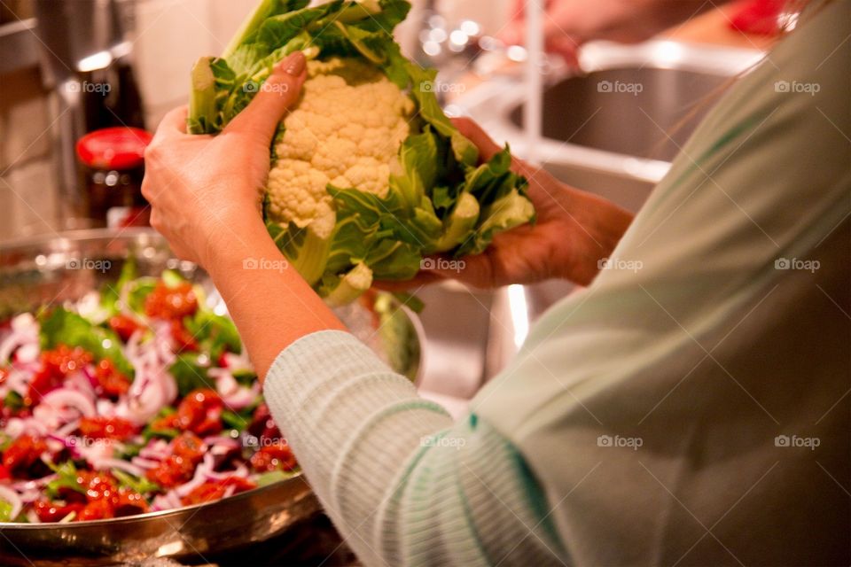 Close-up of woman holding cauliflower