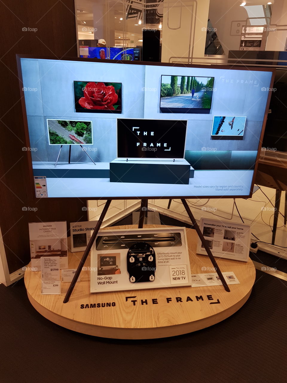 Samsung The Frame art mode 4K Ultra High Definition TV on studio stand easel with no gap wall mount in the premium room at Peter Jones department store Sloane square Chelsea Kings road London