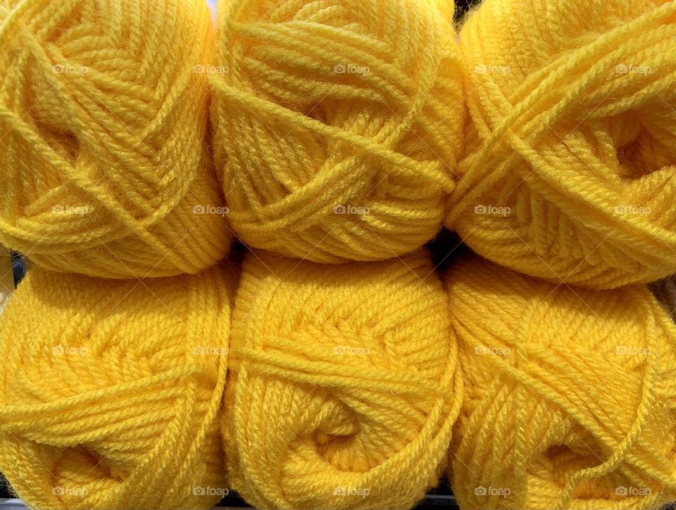 Set of yellow wool yarn balls close up, knitting material, hand made creations 