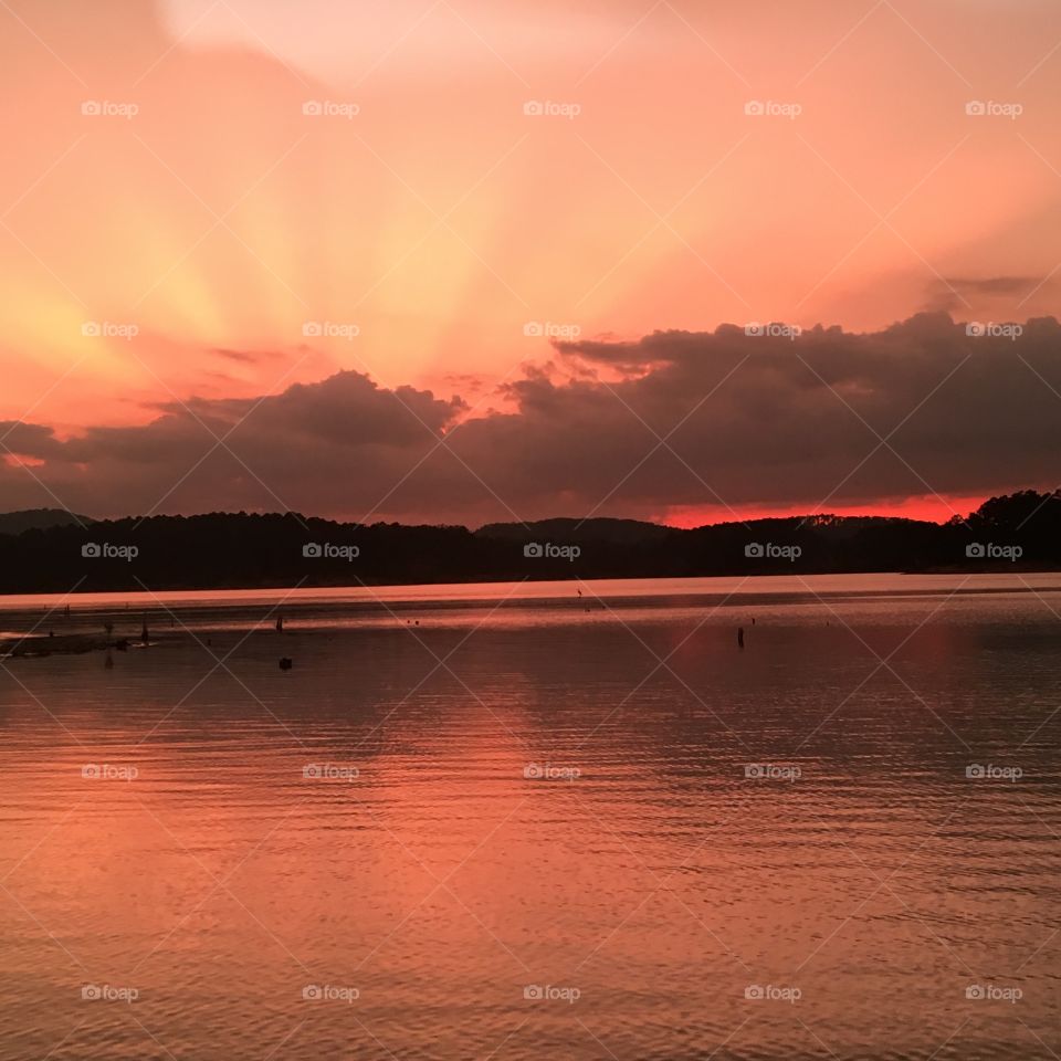 This is a sunset on lake Ouachita in Arkansas . 