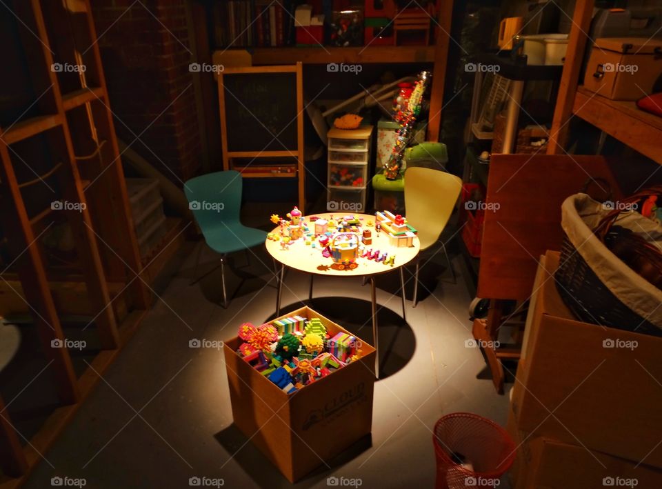 Desk From Above. Child's Desk Full Of Toys In A Play Room
