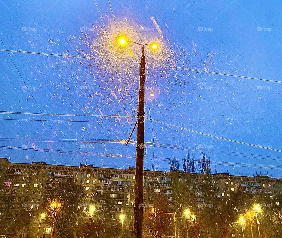 Lantern and falling snow