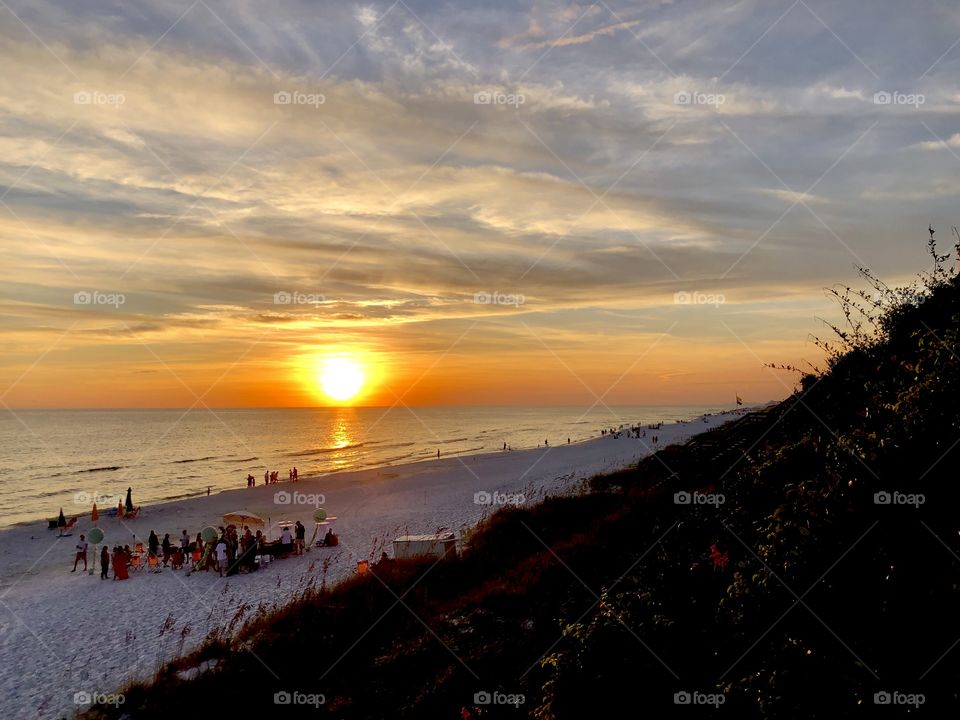 Sunset and people enjoying the beach