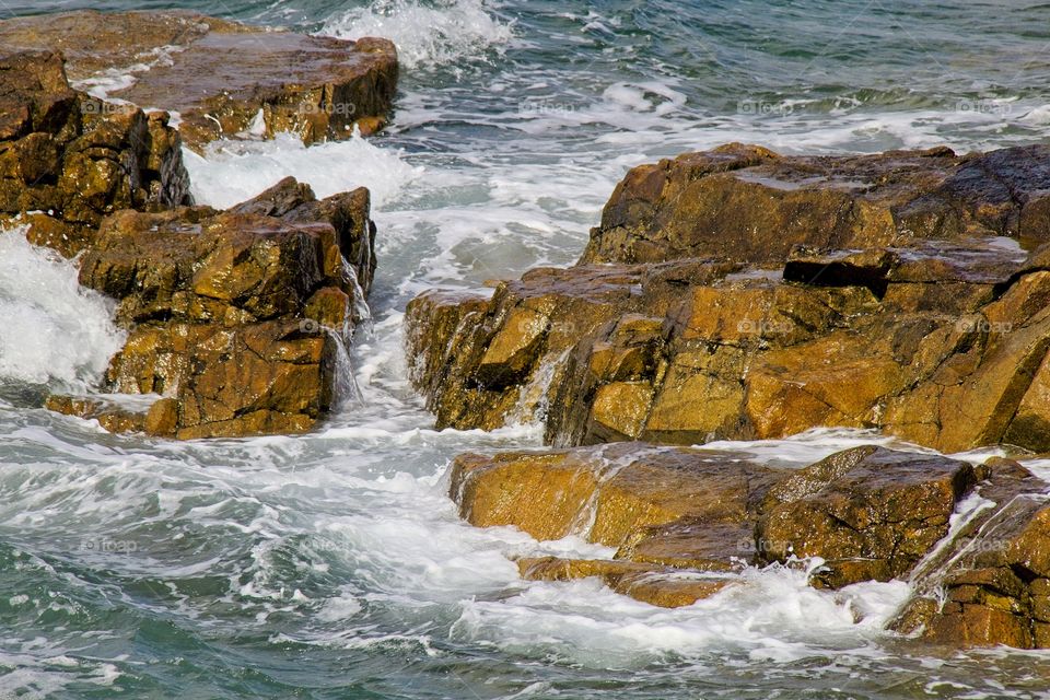 waves crashing on rocks