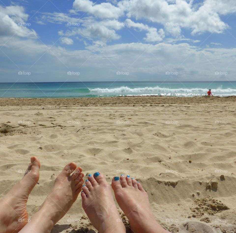 feets on the beach