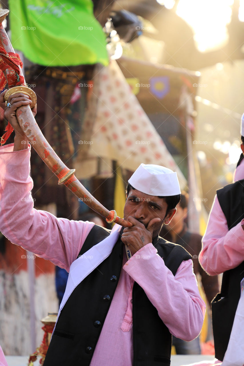 A traditional bugle player in surajkund international crafts fair