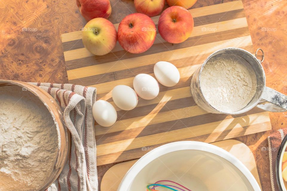 Making homemade puffed apple pie with eggs, sugar and flour.