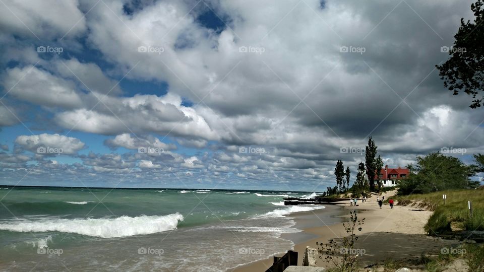 Rough waters on beach by Pointe Bestie Lighthouse